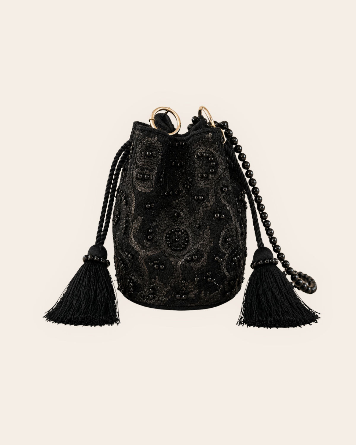Midnight Noir black handmade occasion bag with tonal embroidery, sequins, beads, tassels and a beaded shoulder strap.