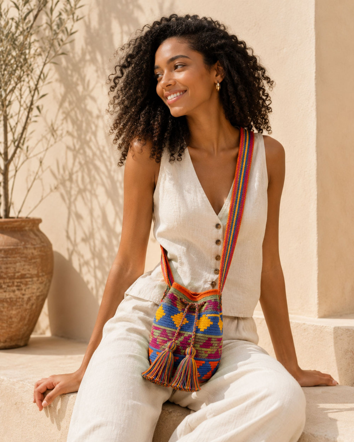Maresa Orange, Blue & Fuchsia Wayuu Crochet Mochila worn during spring and summer.