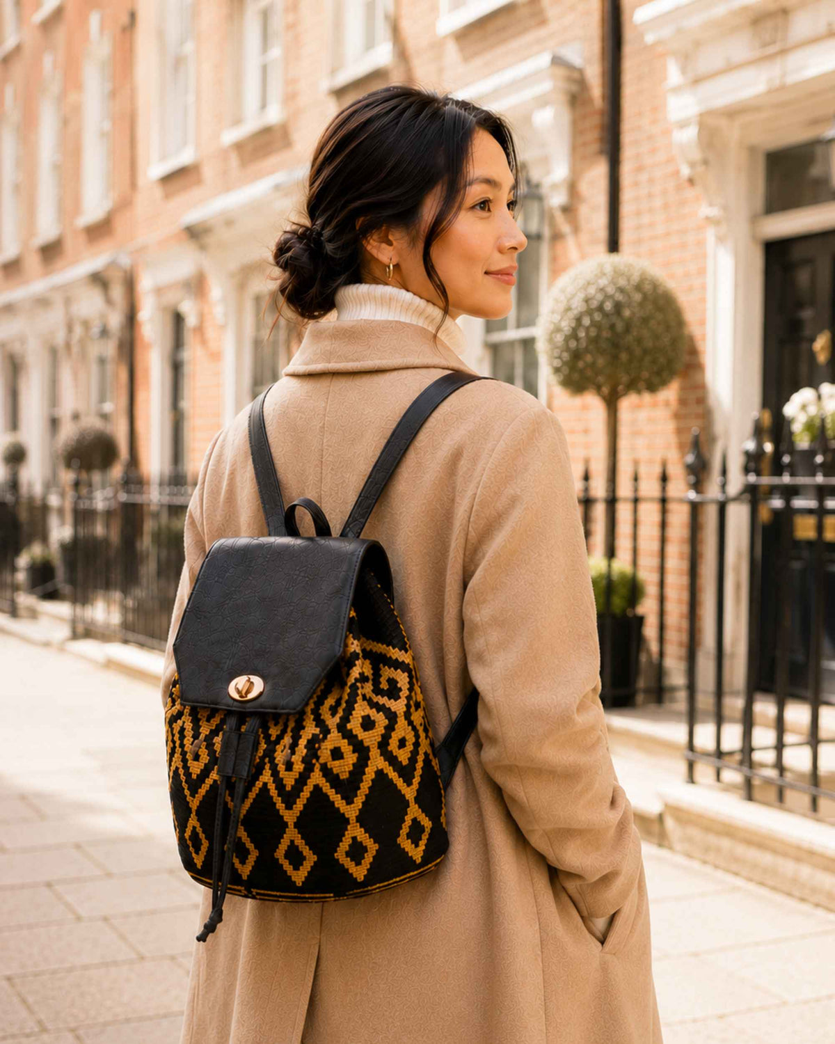 3. Maresa Black & Camel Wayuu Crochet Flap Backpack autumn lifestyle