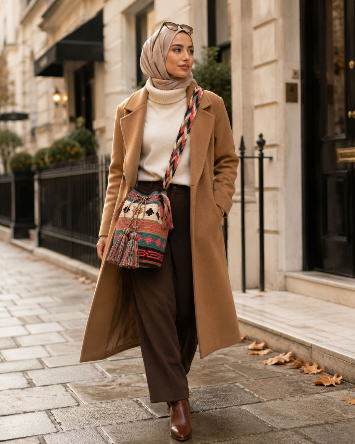 Coral Oasis Wayuu crochet Classic Mochila worn crossbody in an autumn city setting