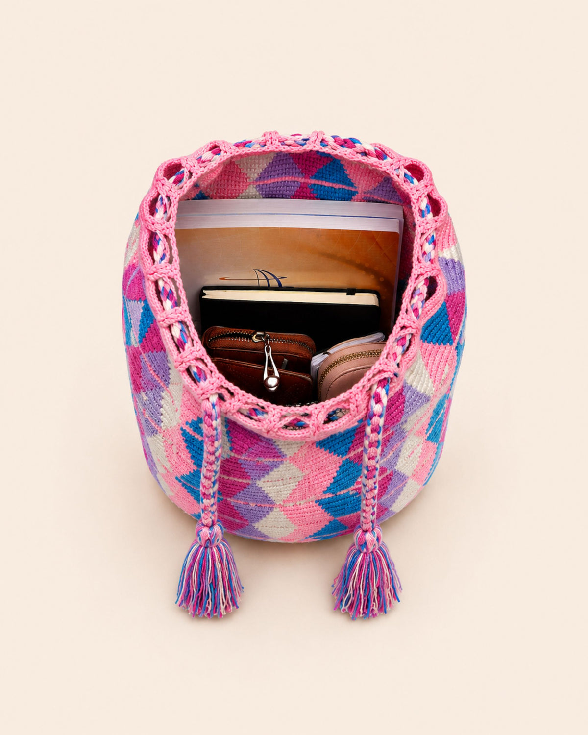 Interior of Maresa Pink Diamond Handwoven Drawstring Backpack showing storage capacity