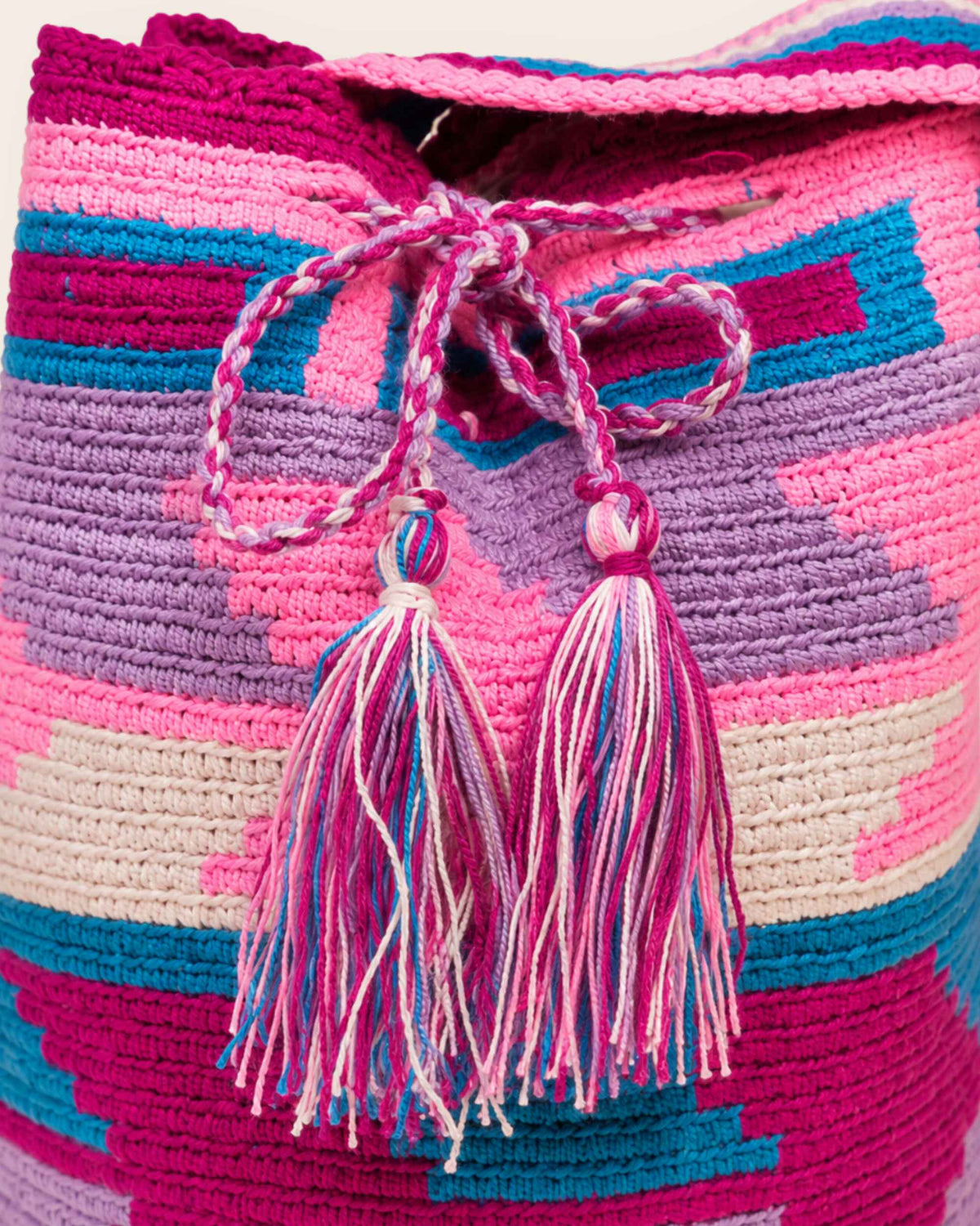 Close-up of the braided drawstring and handmade tassels.