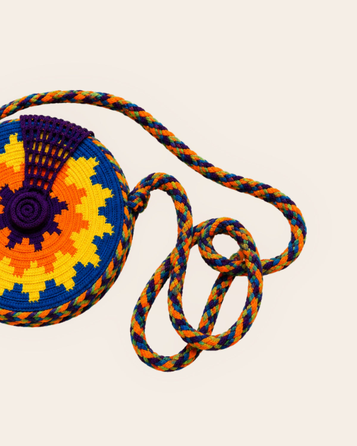 Braided drawstring closure and tassel detail on a Wayuu Crochet Round Mini Bag