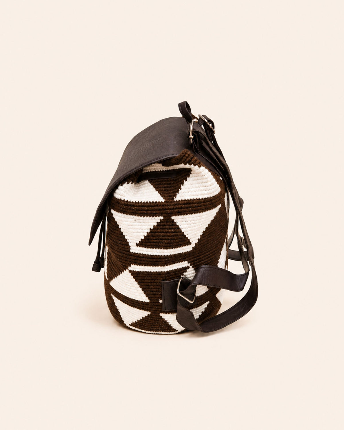 Gold-tone twist-lock fastening detail on Maresa flap backpack