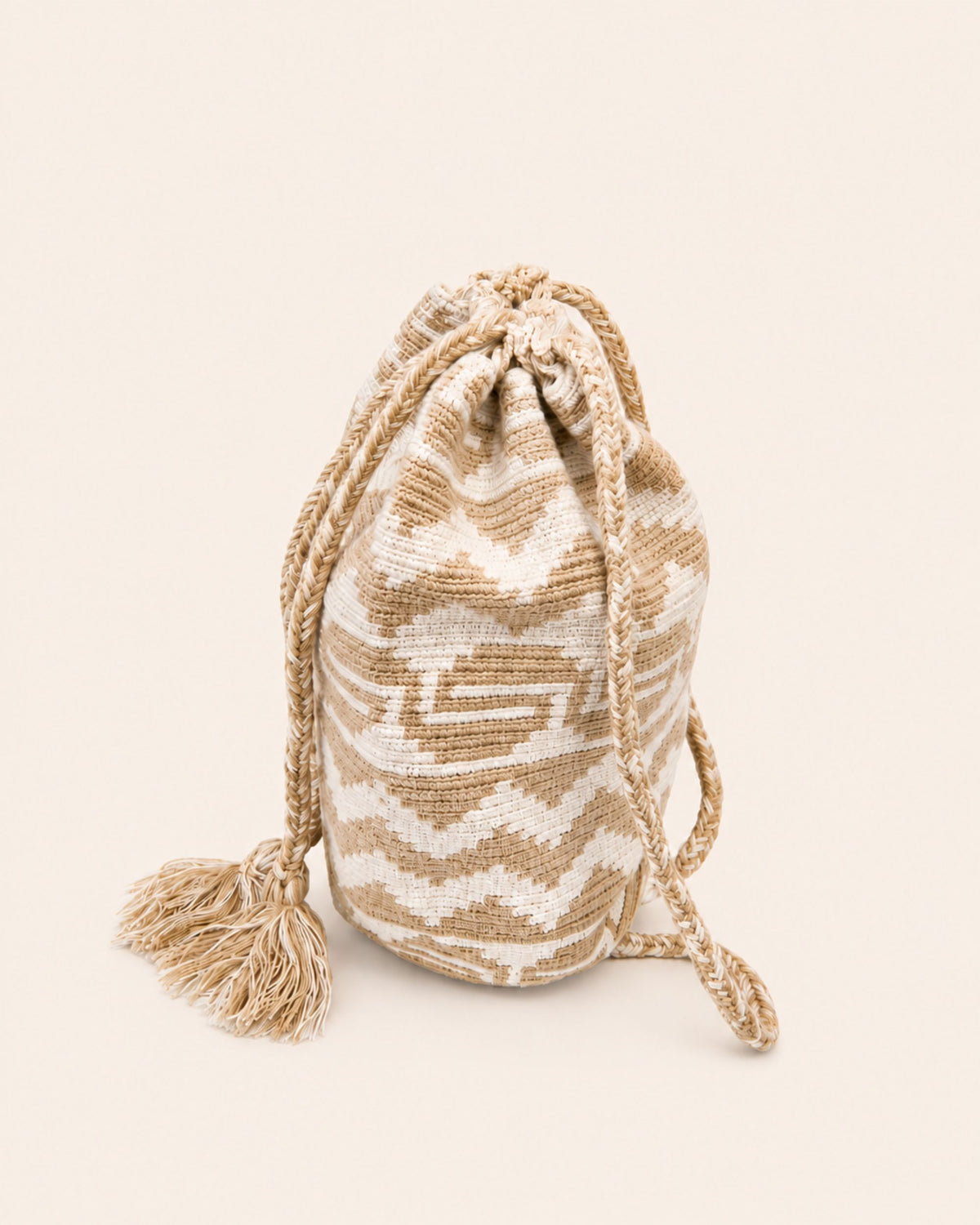 Braided drawstring cords and handmade tassel detail