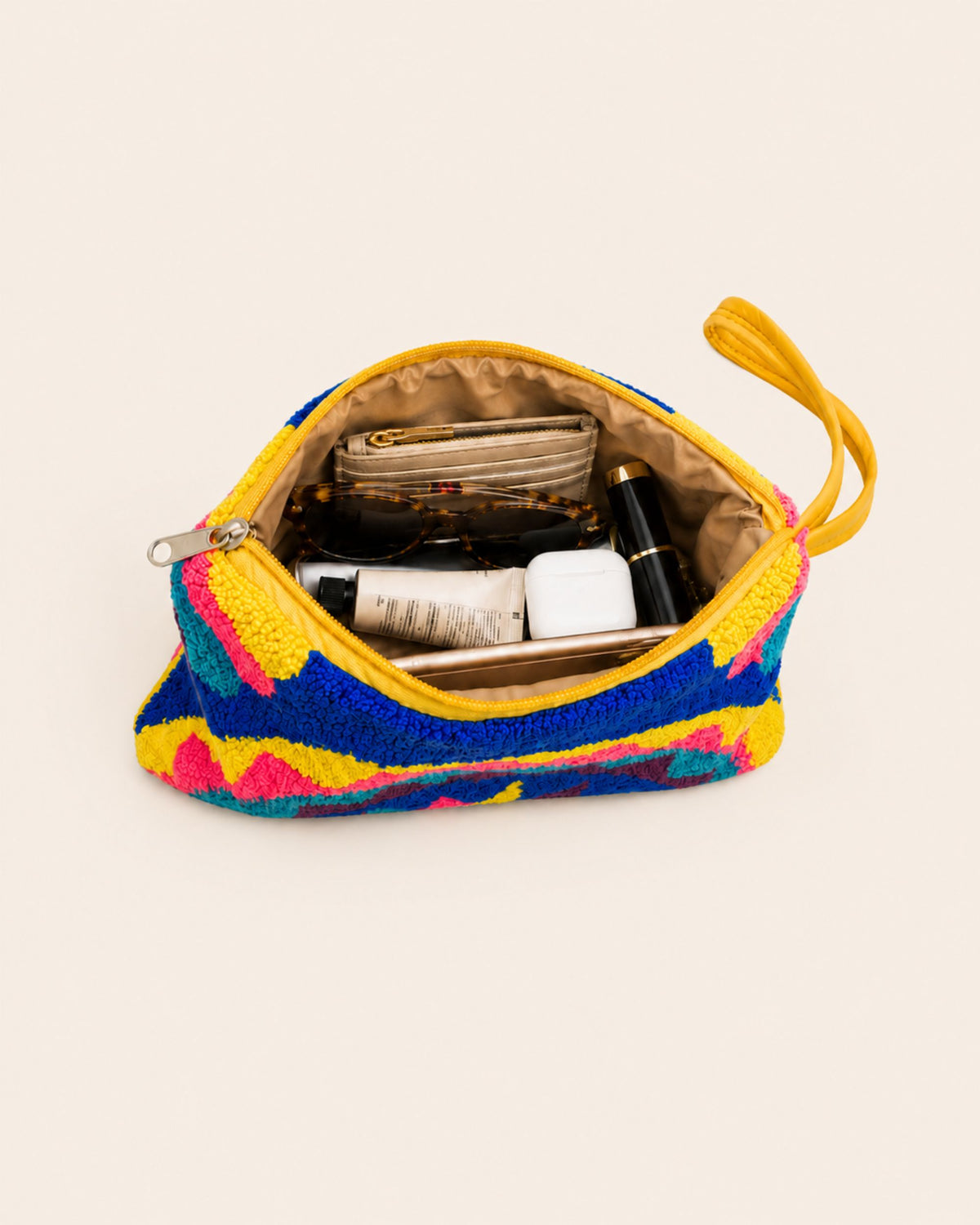 Maresa Blue & Pink Mandala tapestry clutch open with everyday essentials inside