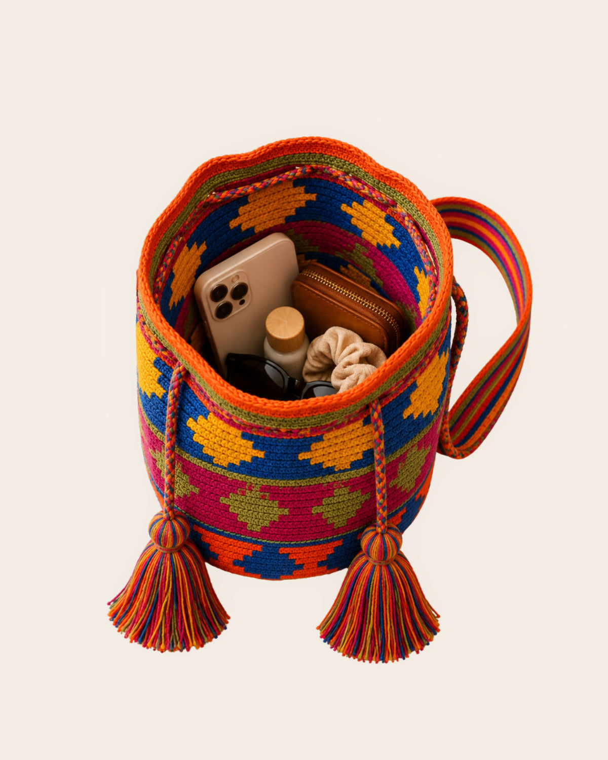 Interior capacity of the Maresa Orange, Blue & Fuchsia Wayuu Crochet Mochila.