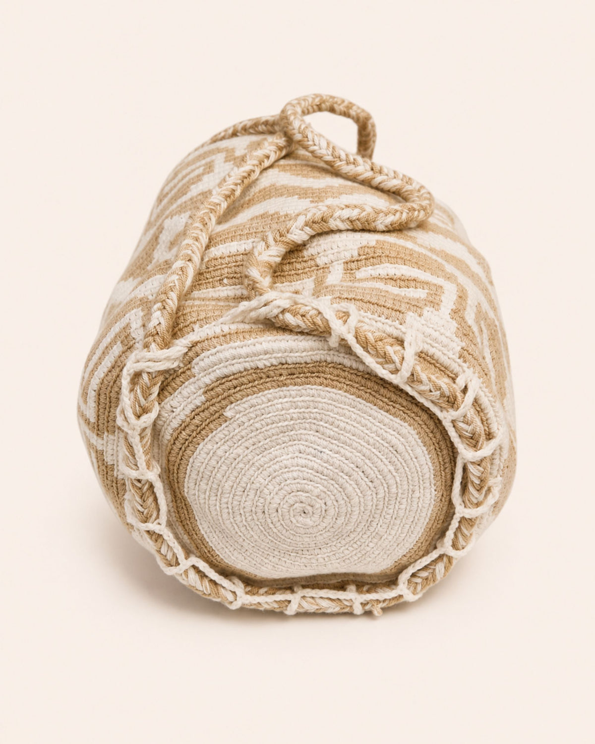 Circular handmade crochet base of the Maresa Sand & Ivory Handwoven Drawstring Backpack