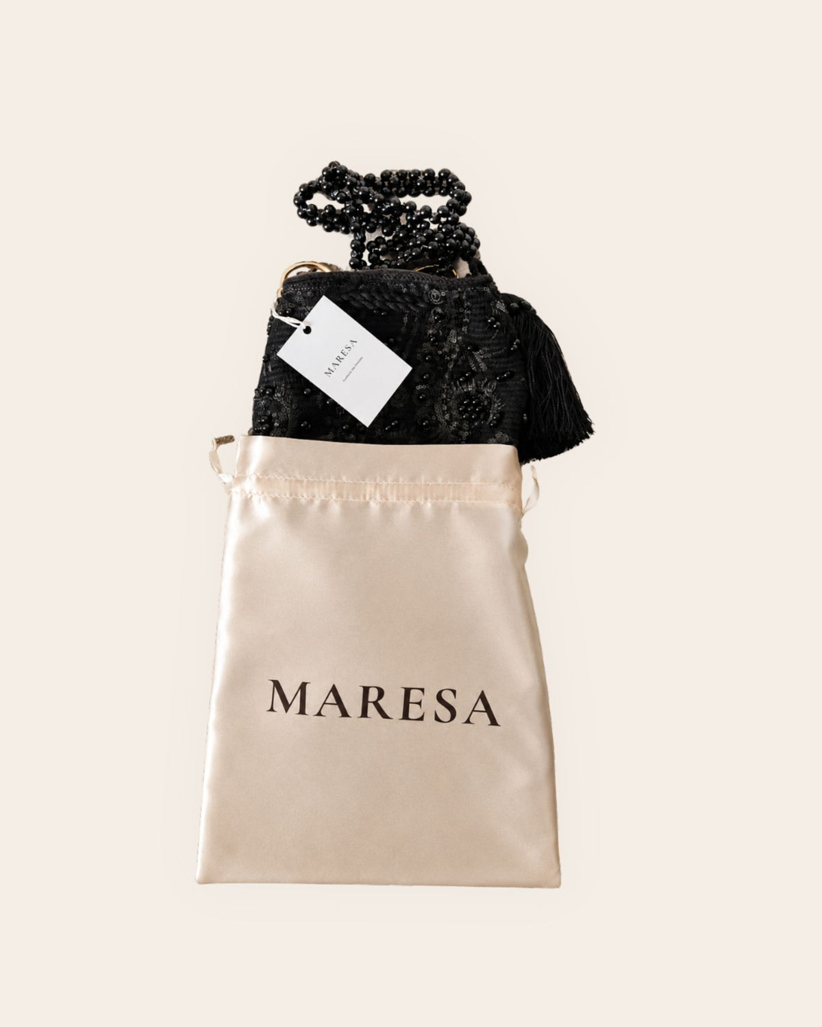 Midnight Noir black embellished handmade occasion bag presented with its Maresa satin dust bag and signature packaging
