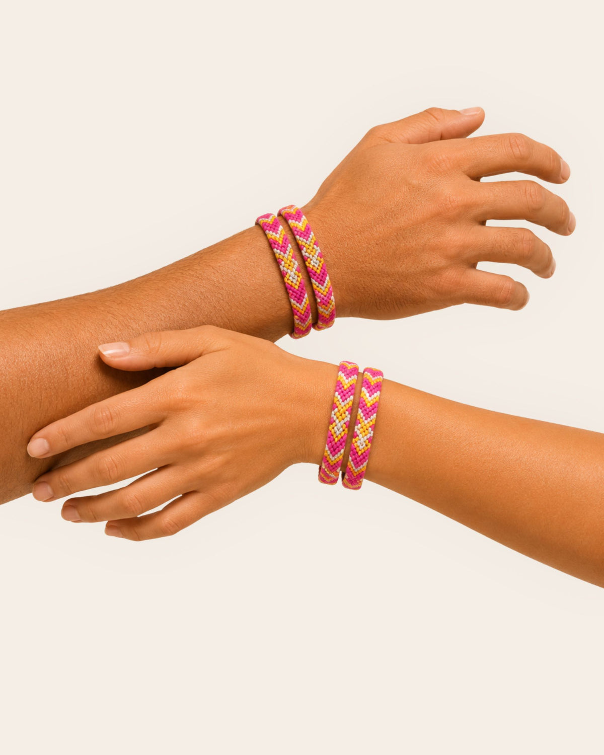 Maresa Fuchsia and Beige handmade Wayuu woven bracelet with geometric pattern worn on the wrist