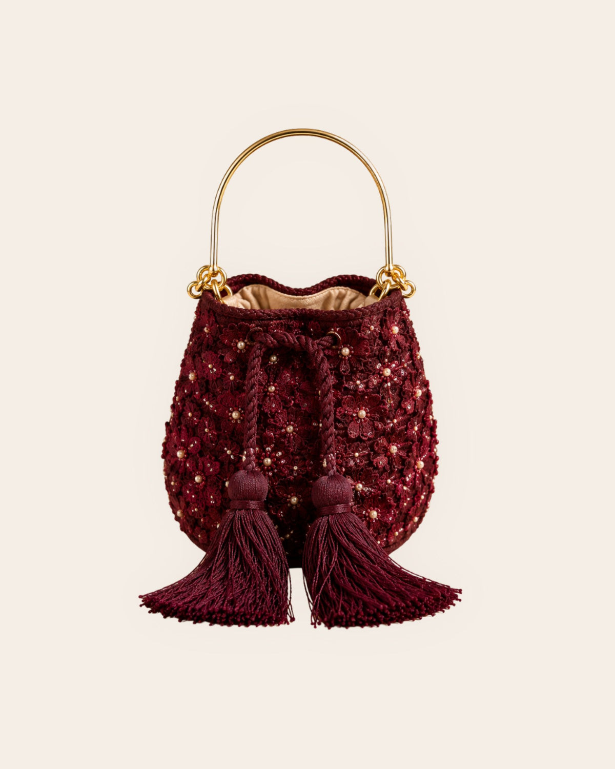 Burgundy floral embellished handmade occasion bag with gold-tone handle and tassel drawstring closure 