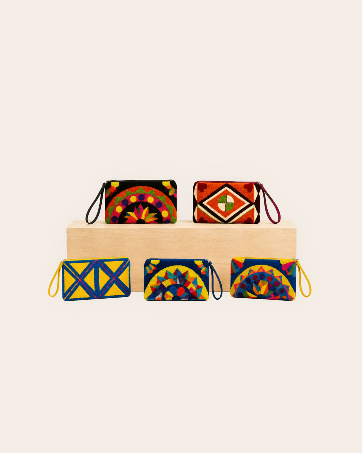 Maresa handcrafted tapestry clutch collection featuring colourful geometric designs 