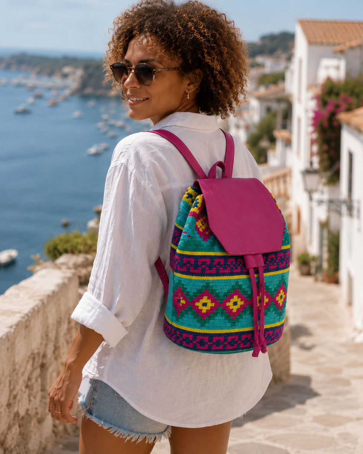2.	Maresa Fuchsia & Turquoise Wayuu Crochet Flap Backpack lifestyle image 