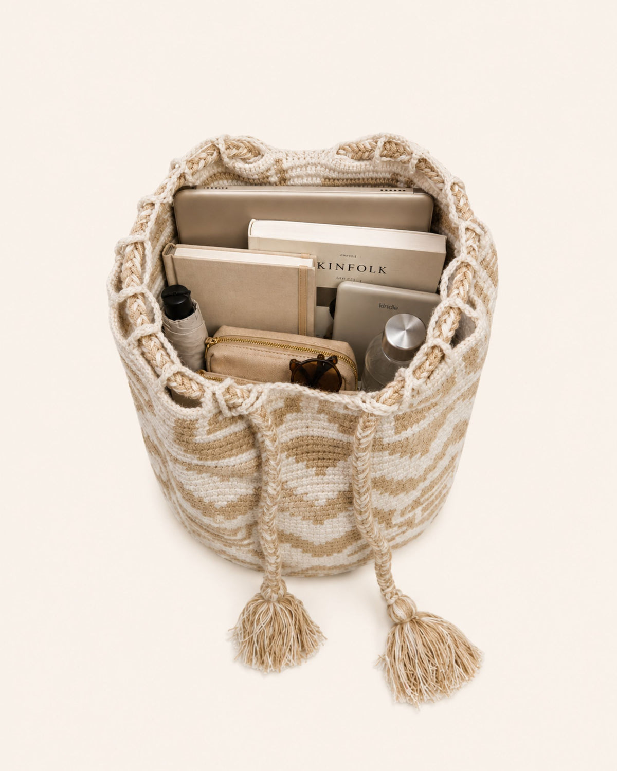 Interior of Maresa Sand & Ivory Handwoven Drawstring Backpack showing storage capacity 