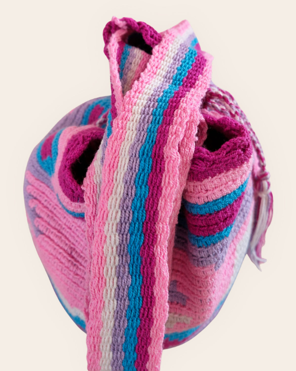 Close-up of the handwoven shoulder strap on the Maresa Orchid Lagoon Wayuu Crochet Mochila.