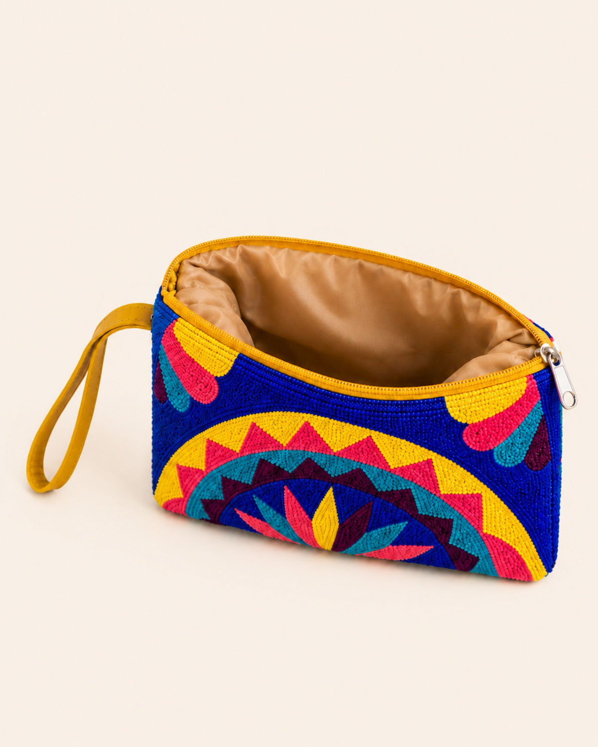 Interior of the Maresa Blue & Pink Mandala tapestry clutch showing its lined compartment and zip closure 