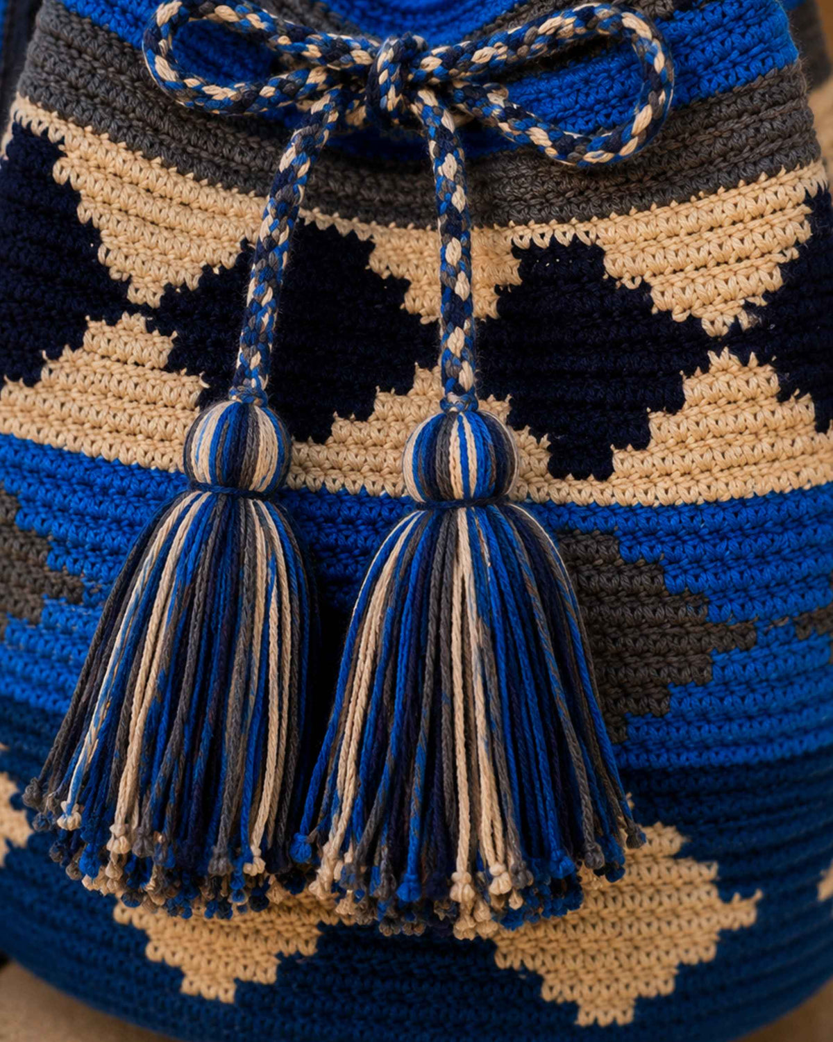 Close-up of the geometric Wayuu crochet pattern and handmade tassels