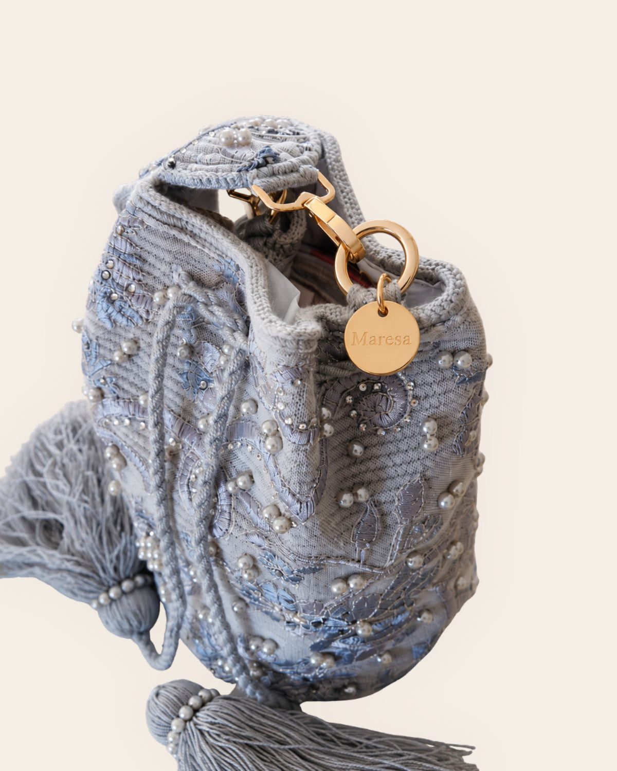 Pearl grey embellished occasion bag with gold-tone hardware and engraved Maresa charm 