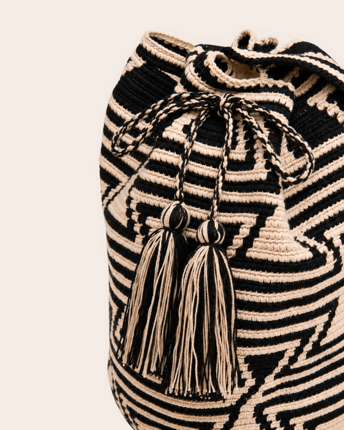 Braided drawstring and tassel detail on Sand and Black Wayuu Mochila