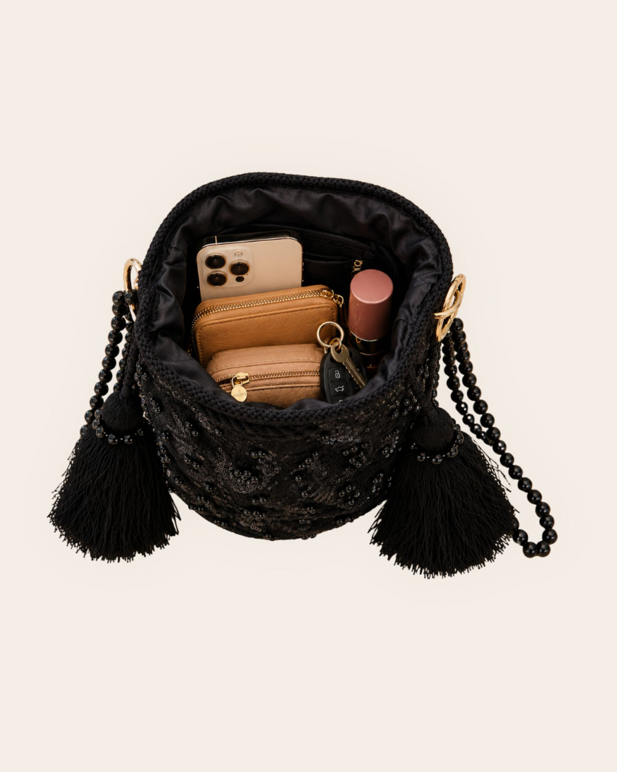 Open Midnight Noir occasion bag showing waterproof interior lining, internal slip pocket and capacity for everyday essentials