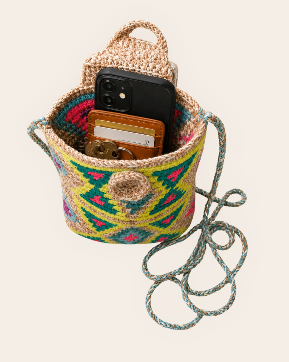 Open handmade mini crossbody bag showing space for a phone, card holder and keys 