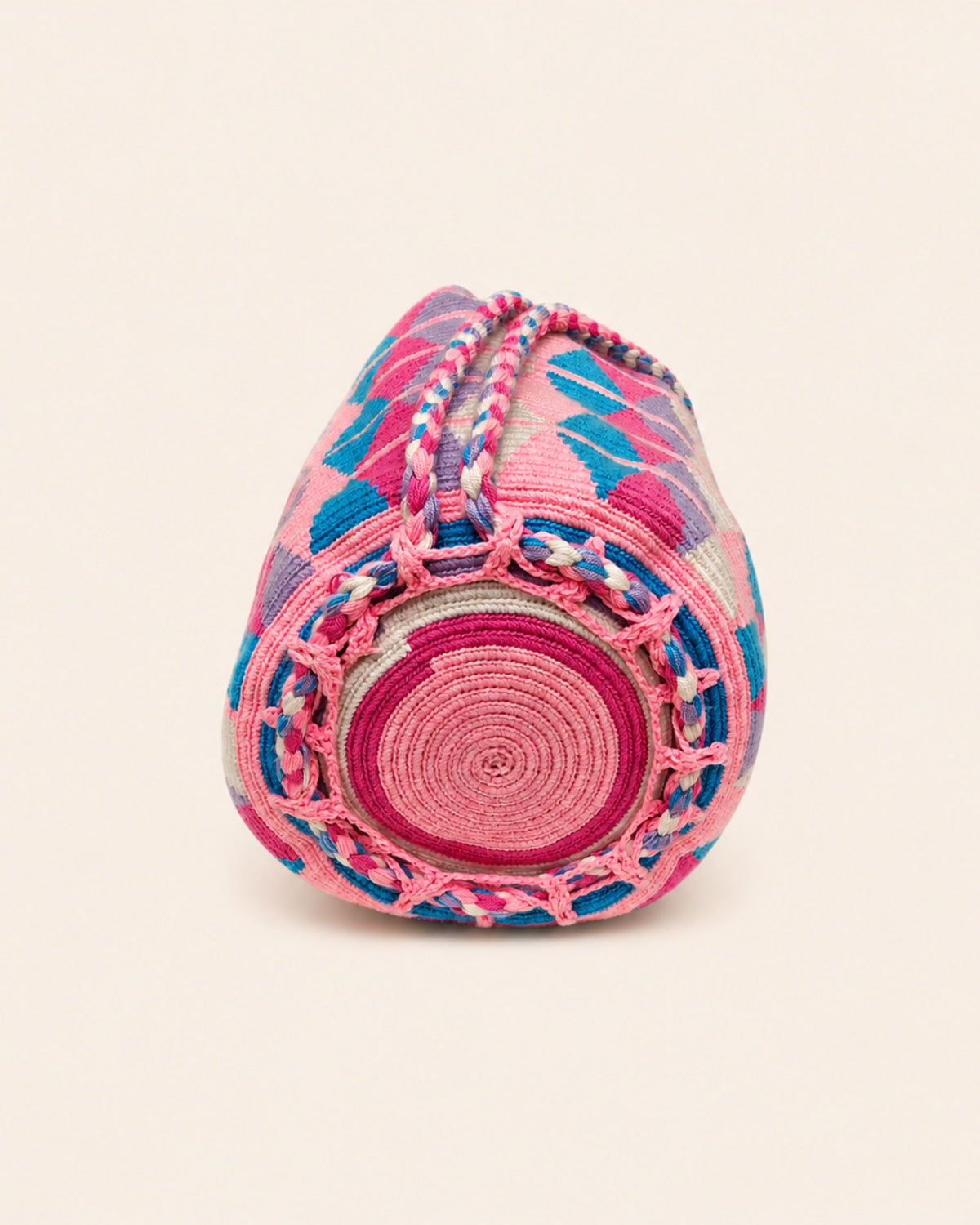 Circular handmade crochet base of the Maresa Pink Diamond Wayuu Crochet Handwoven Drawstring Backpack 