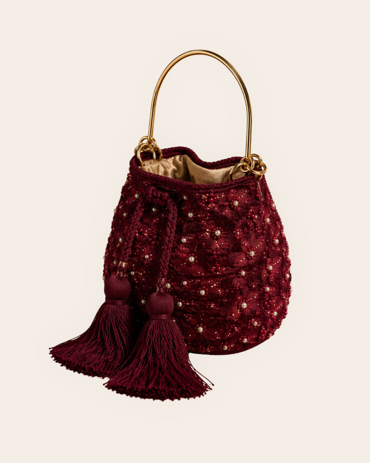 Burgundy floral embellished handmade occasion bag with gold-tone handle and matching tassels 