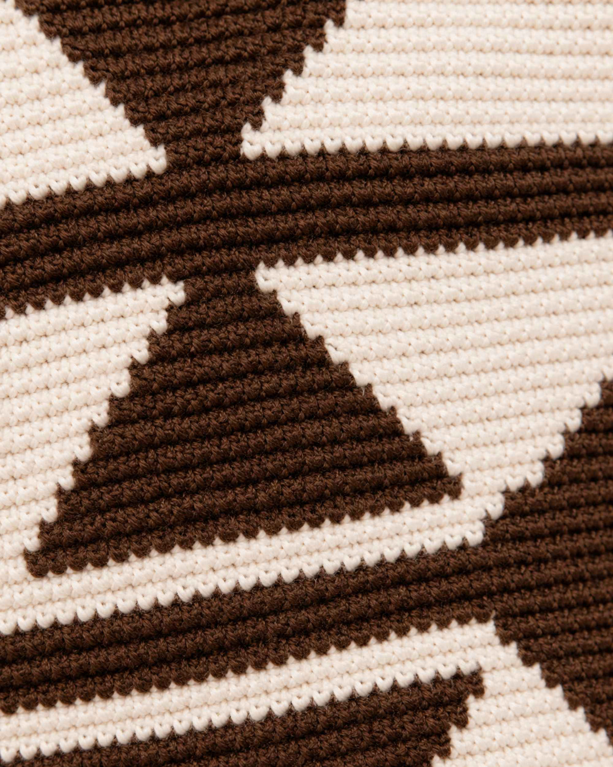 Side profile of Maresa Chocolate & Ivory Wayuu Crochet Flap Backpack