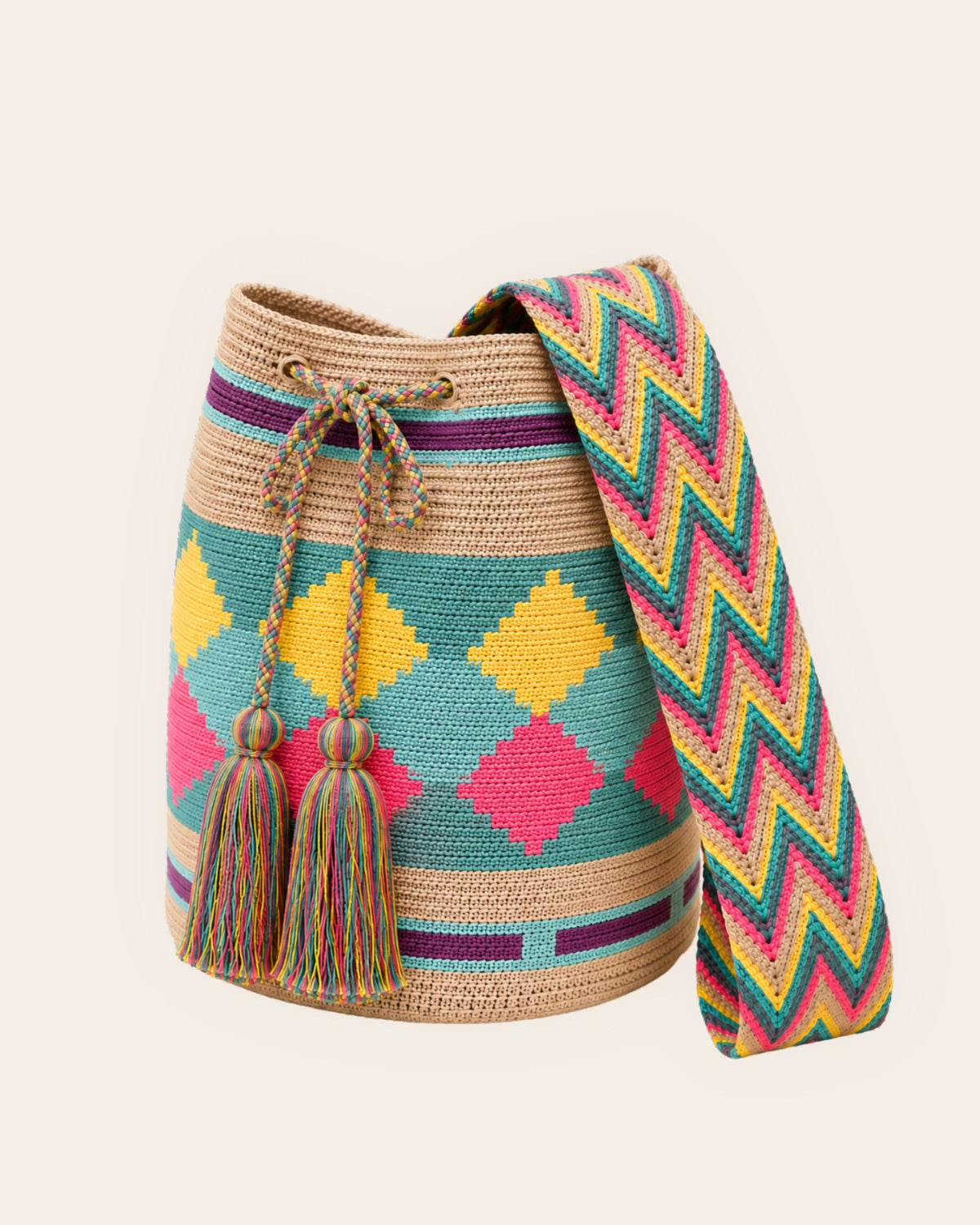 Side profile of Maresa sand multicolour diamond pattern Wayuu crochet mochila 