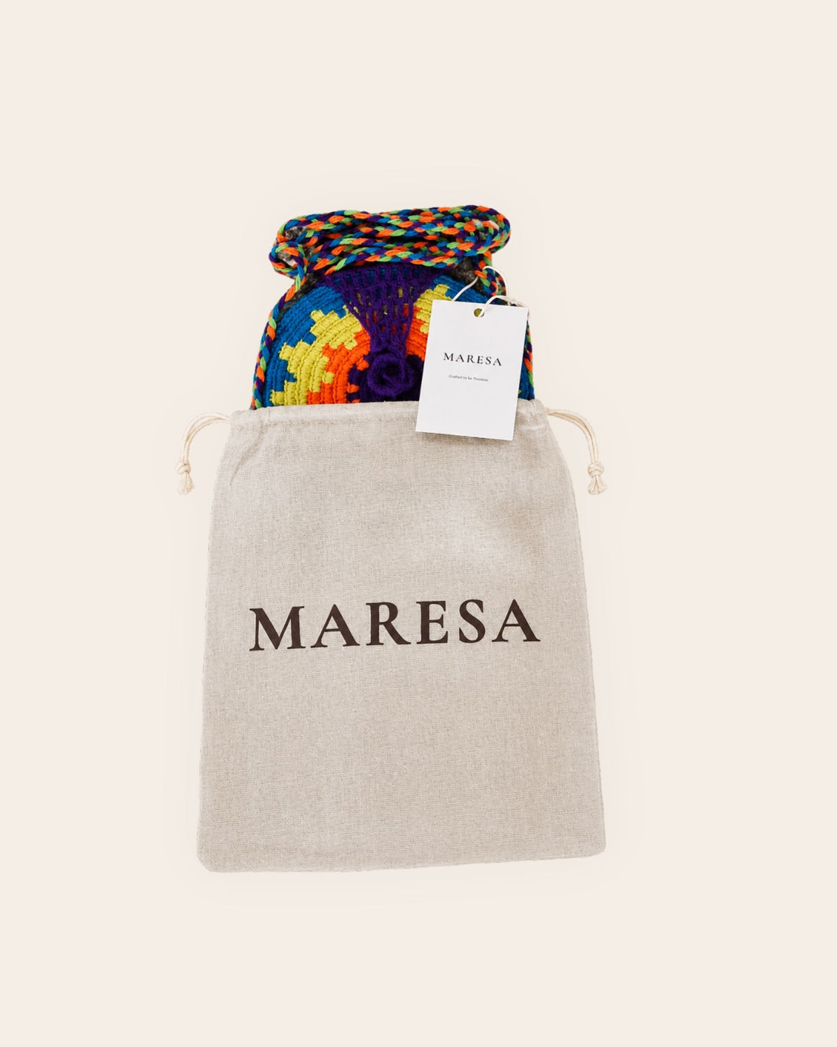 Maresa handmade Wayuu crochet round mini bag with multicolour design, swing tag and branded cotton dust bag