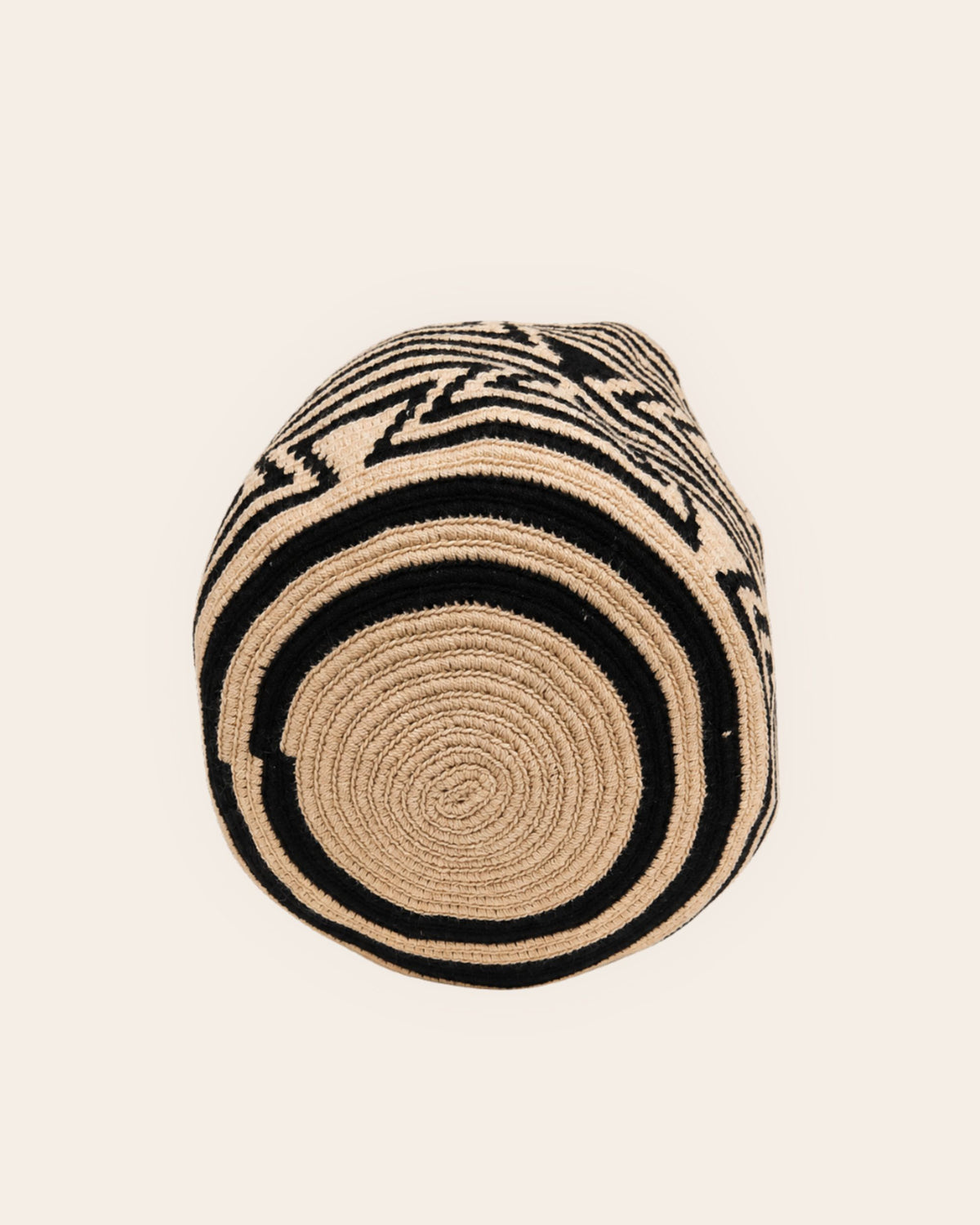 Hand-crocheted circular base of Sand and Black Wayuu Classic Mochila