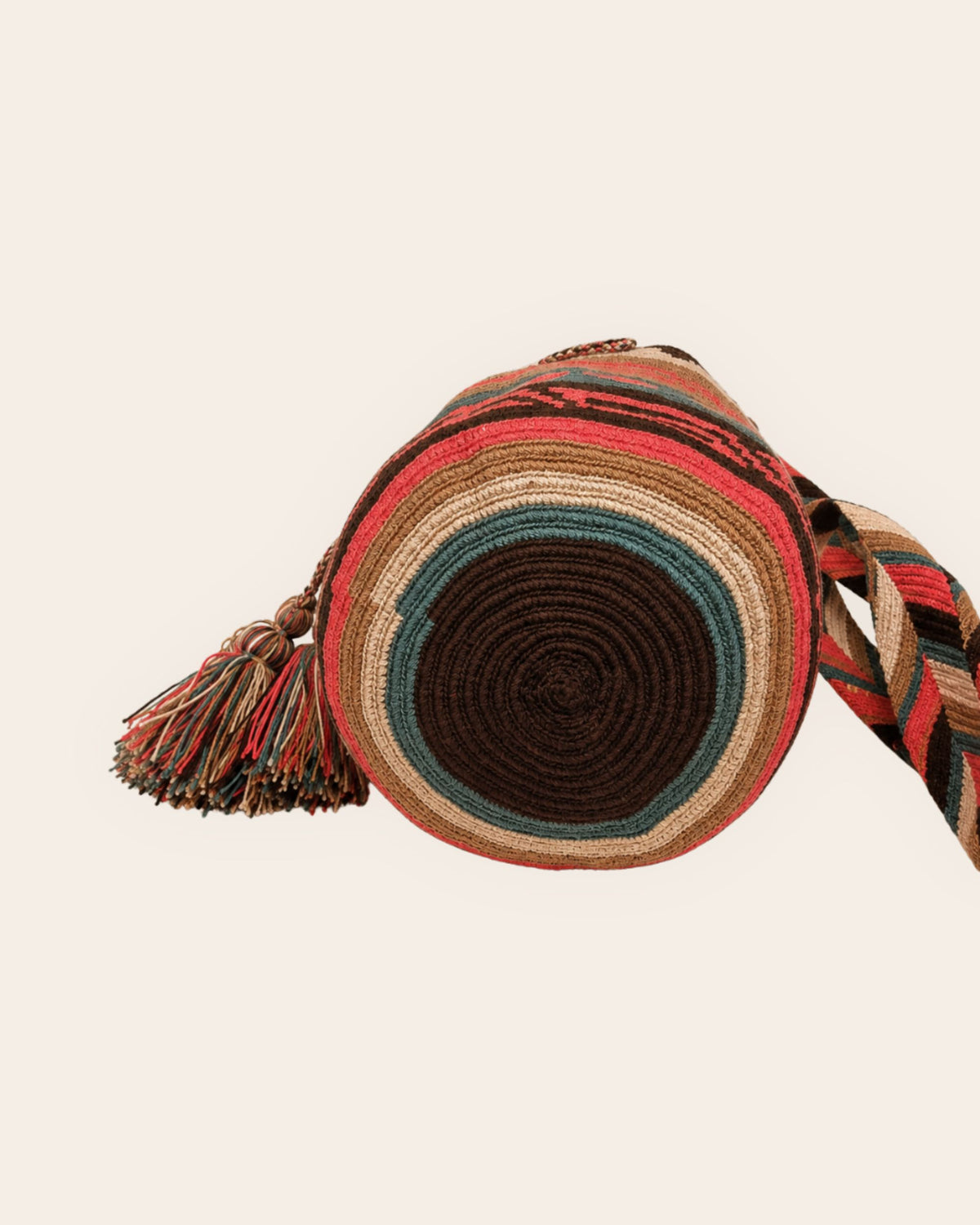 Circular crochet base of the Coral Oasis Wayuu Classic Mochila in chocolate, sage, sand and coral