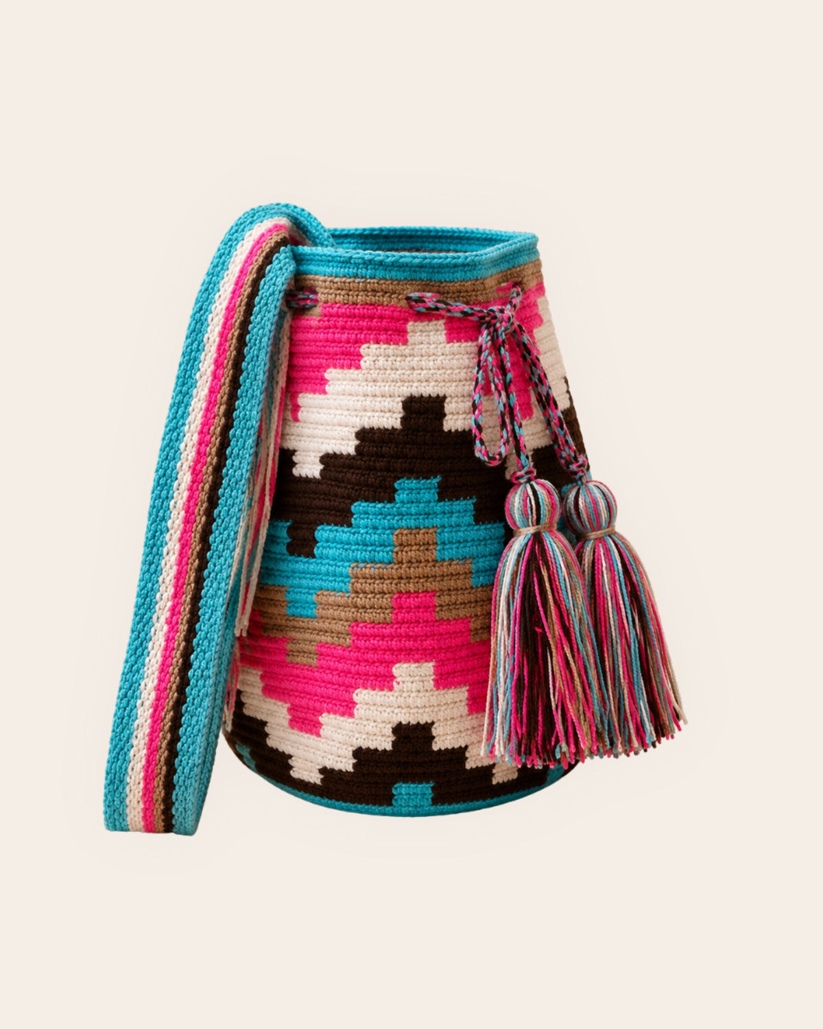 Side profile of the Maresa Turquoise, Fuchsia & Chocolate Wayuu Crochet Mochila.