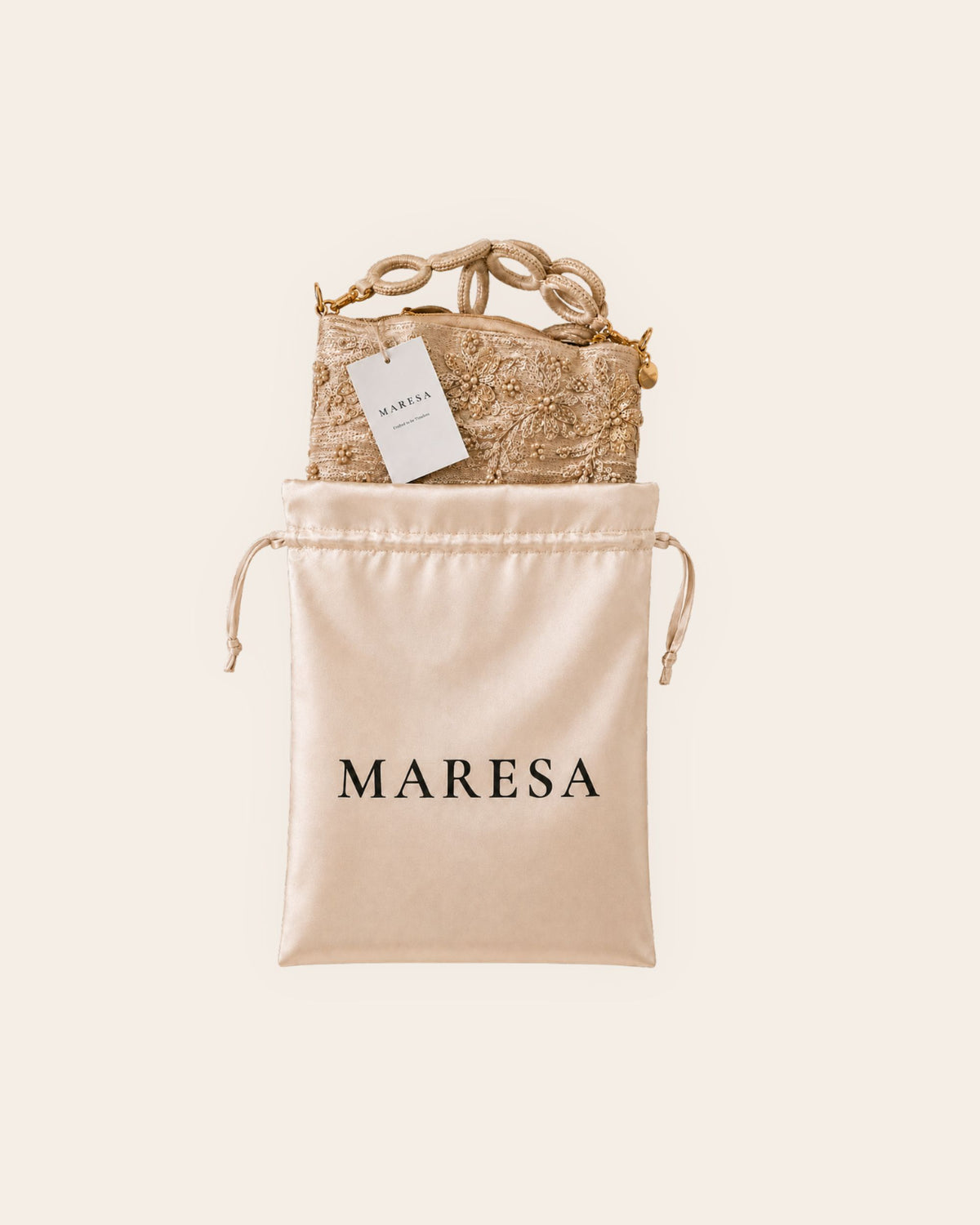 Champagne embellished handmade occasion bag with Maresa satin storage bag